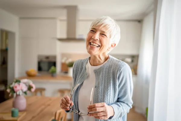stock image Close up portrait of one senior woman with short hair happy smile positive emotion copy space standing at home indoor gray white hair