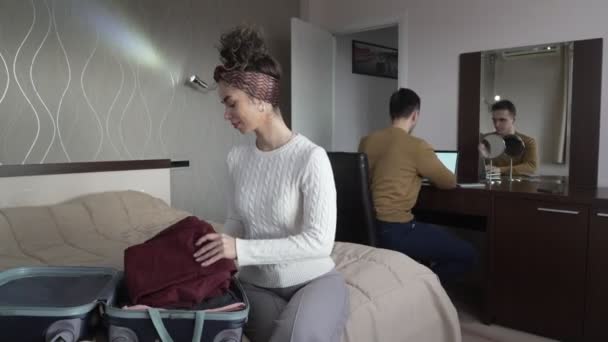 Woman Caucasian Couple Unpack Wardrobe Cloth Suitcase Hotel Room While — Stock Video