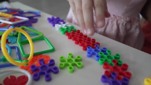Close Hands Unknown Child Play Interlocking Plastic Toys — Stock Video