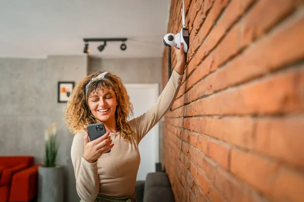 One Adult Caucasian Woman Adjust Prepare Home Surveillance Security Camera — Stock Photo, Image