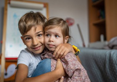 siblings portrait caucasian boy and girl brother and sister at home
