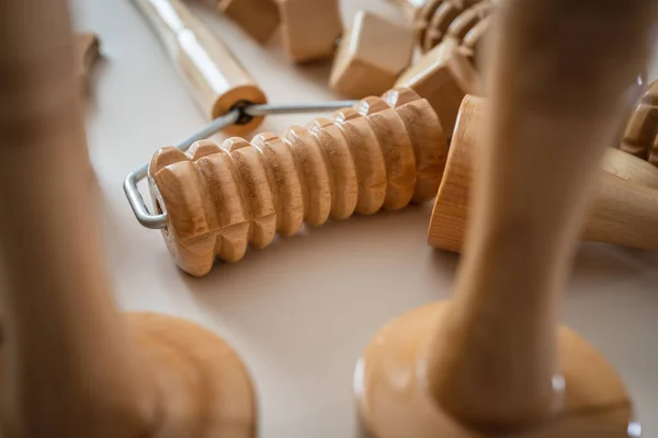 Wood massage maderotherapy madero therapy wooden rolling pin or battledore tools for anti cellulite treatment to stimulate the lymphatic system and improve circulation concept