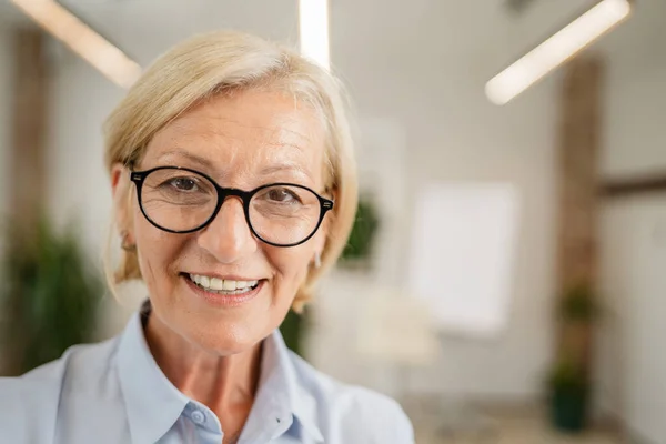 Portrait One Mature Blonde Caucasian Woman Eyeglasses Home Office Happy — ストック写真
