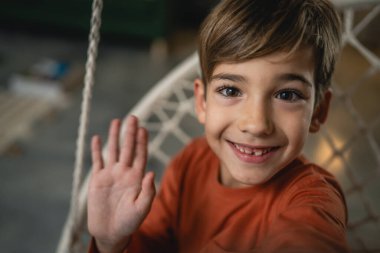 One boy caucasian child seven years old kid at home schoolboy portrait ugc self portrait