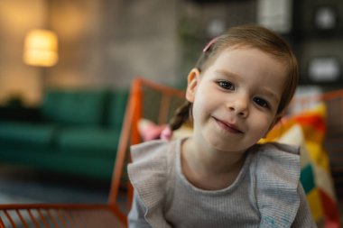portrait of small caucasian girl two years old toddler at home