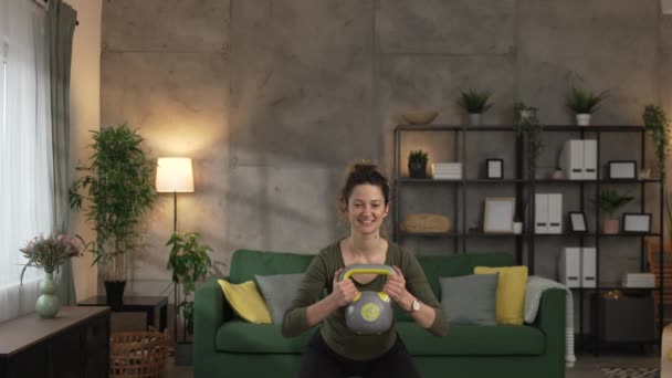 One Adult Woman Training Home Use Kettlebell Girya Weight — Stock Video