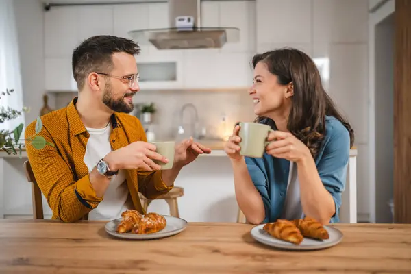 Adult couple have breakfast and cup of coffee at home morning routine