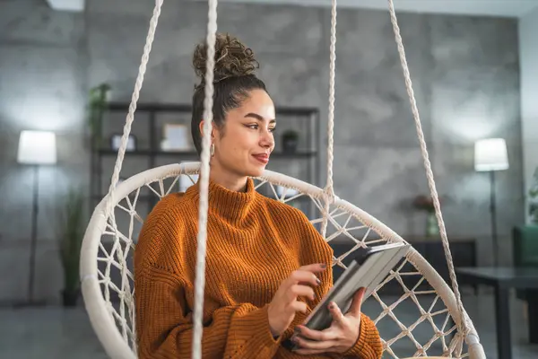 stock image One young woman use digital tablet at home