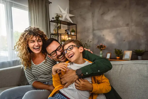 stock image Portrait of mum,dad and son sit on sofa and have family time at home