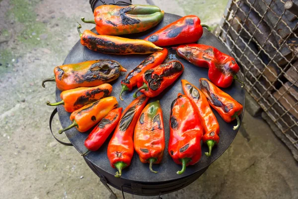 Top View Roasted Red Peppers Circular Burner Wood Fired Stove Stock Image