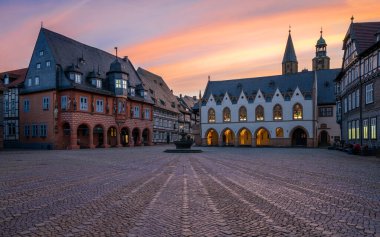 GOSLAR, GERMANY - FEBRUARY 4, 2023: Historic buildings of Goslar during sunset on February 4, 2023 in Lower Saxony, Germany clipart