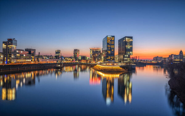 DUSSELDORF, GERMANY - FEBRUARY 14, 2023: Panoramic image of modern buildings in the media harbor of Dusseldorf on February 14, 2023 in Germany, Europe