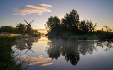 Hengstforder mill close to Bad Zwischenahn on a foggy morning, Lower Saxony, Germany clipart