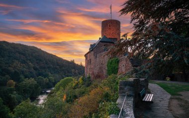 Heimbach, Germany - October 5, 2023: Panoramic image of Hengebach castle during sundown on October 5, 2023 in North Rhine Westfalia, Germany clipart