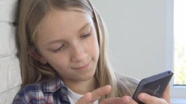 Young Girl Playing Smartphone, Kid Browsing Internet on Phone, Teenager Child Reading Messages, Searching Online on Devices
