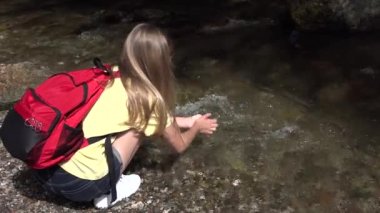 Child Washing Hands in River Water, Kid Playing in Spring Waterfall, Tourist Girl Hiking at Camping in Mountains, Trip, Excursion