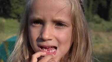 Child Studying Her Tooth, Kid Baby Teeth, Little Girl Looking and Smiling, Playing in Camera, Children Outdoor in Nature