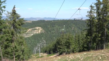 Chairlift, Ski Lift in Alps, Alpine Cable Car, Summer Sports, Off Road  Adventure, Tourists with Mountain Bikes