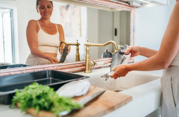 Smiling Young Adult Woman Washing Fish Kitchen Sink Water Tap — Stock Photo, Image