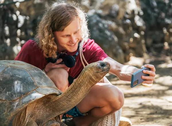 Smiling Tourist Boy Making Selfie Using Cell Phone Aldabra Giant Stok Lukisan  