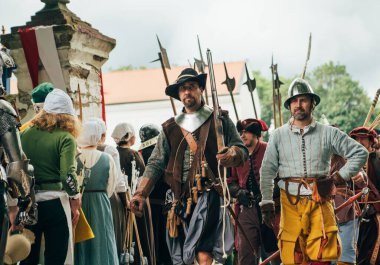 Cerven Kamen Castle, Slovakia - May 25, 2024: People in medieval attires historical reenactment event. Reconstructions provide valuable insights into daily life, past eras traditions in Slovakia. clipart