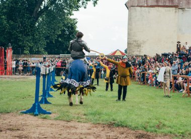 Cerveny Kame Castle, Slovakia - May 25, 2024: People in medieval attires historical reenactment event. Reconstructions provide valuable insights into daily life, past eras traditions in Slovakia. clipart