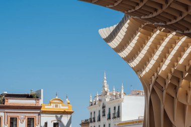 Contemporary city architecture of Metropol Parasol or Las Setas - large structure located at La Encarnacion square in old quarter of Seville, Spain.  clipart