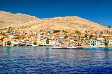 Halki, Greece - July 6, 2022: Port in  island Halki (Chalki) in Aegean sea, part of Dodecanese islands in Greece