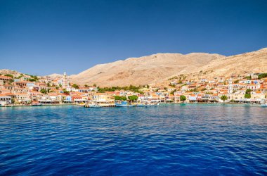 Halki, Greece - July 6, 2022: Fishing village in island Halki (Chalki) in Greece