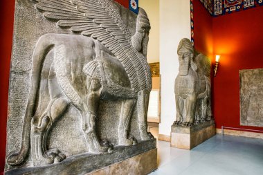 Berlin, Germany - April 7, 2017: Assyrian Lamassu or winged bull in Pergamon museum in city Berlin at Germany clipart