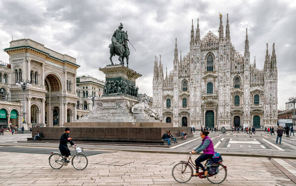 Milan, Italy - April 15, 2018: Cathedral Duomo di Milan and Statue Vittorio Emanuele II in centre of city