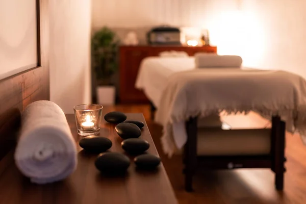 Towel Candle Lava Stones Spa Salon Bluerred Massage Table Background — Stock Photo, Image