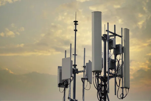 4G and 5G cellular. Macro Base Station or Base Transceiver Station. Telecommunication tower. Wireless Communication Antenna Transmitter. Development of communication systems in urban area at sunset.