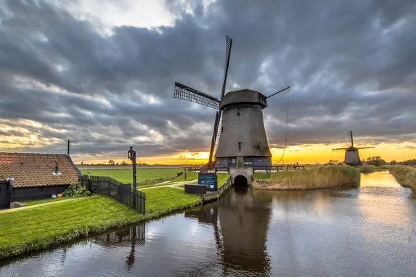 Traditional wooden windmill in old agricultural landscape historic water management pumping station near Schermerhorn, North Holland. Netherlands