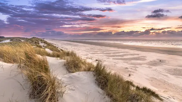 Sunset View from dune top over North Sea from the island of Ameland, Friesland, Netherlands