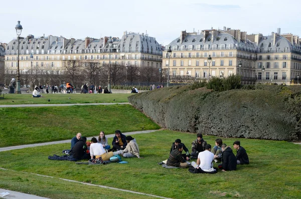 stock image Paris, France - March 16, 2023: People on the grass at the beautiful Tuileries gardens in Paris, France