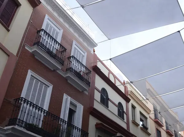 Awnings over the street to protect of the summer  in the Old Town of Seville, Andalusia, Spain.
