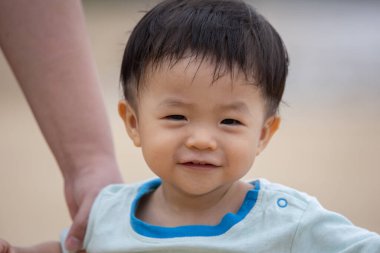 little boy have a good time at the beach