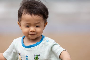 little boy have a good time at the beach