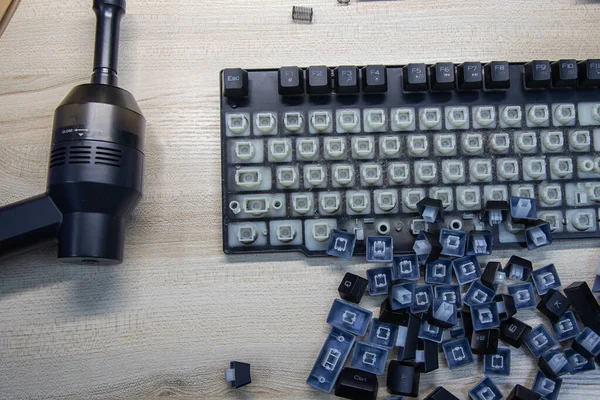 Disassembly and cleaning of the computer keyboard on table