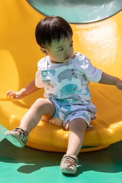 stock image Portrait image of 1 to 2 years old childhood child. Face of smile and laugh Asian boy in head shot. Happy kid playing at the park playground