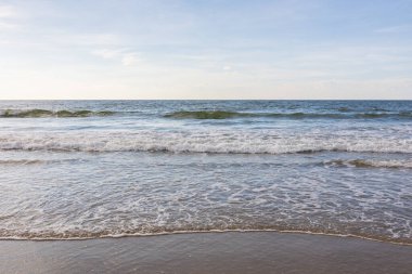 beautiful and clean beach with beach wave during evening