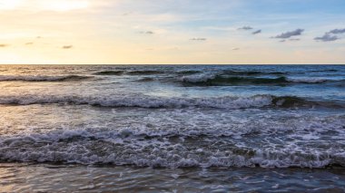 Point of view image of beautiful and clean beach with beach wave during evening