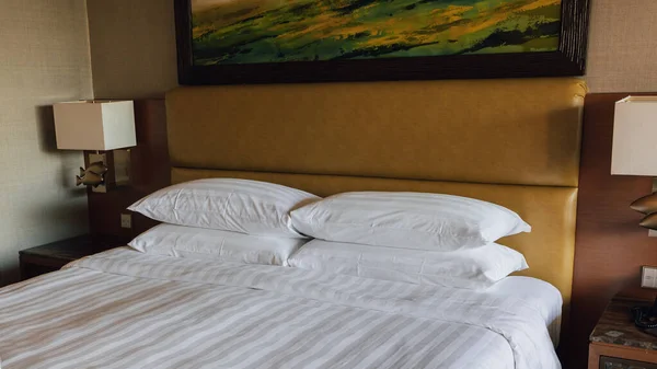 Comfort and clean white bed sheet on hotel room
