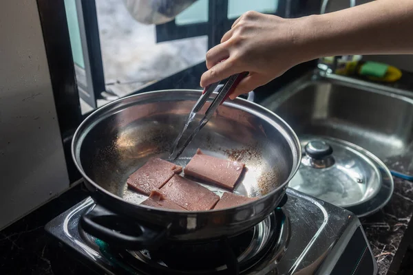 Lady Hand fried luncheon meat as a breakfast