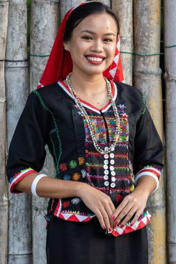 Penampang,Sabah-May 31,2023 : Portrait image of young lady from Kadazandusun ethnic wearing traditional costumes during Kaamatan Festival at KDCA Penampang,Sabah, Malaysia clipart