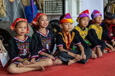 Penampang,Sabah-May 31,2023 : Portrait image of group of kids Kadazandusun ethnic wearing traditional costumes during Kaamatan Festival at KDCA Penampang,Sabah, Malaysia clipart