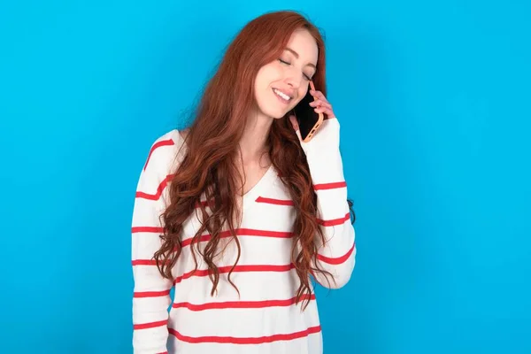 Funny Young Woman Wearing Striped Sweater Blue Background Laughs Happily — Stock Photo, Image