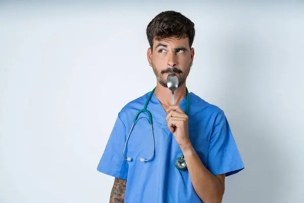 Very Hungry Handsome Nurse Man Wearing Surgeon Uniform White Background — Stock Photo, Image