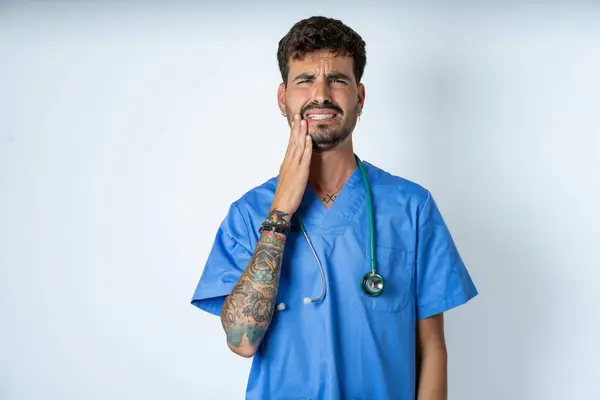 Handsome Nurse Man Wearing Surgeon Uniform White Background Touching Mouth — Stock Photo, Image